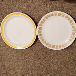2 sets of 4 plates each ! Corella by corning!